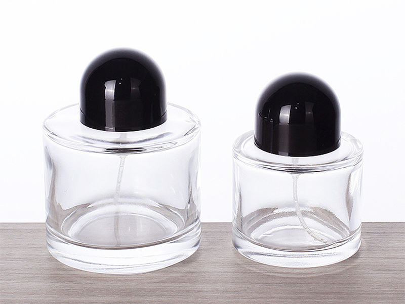 Transparent glass cylindrical perfume bottle with lid