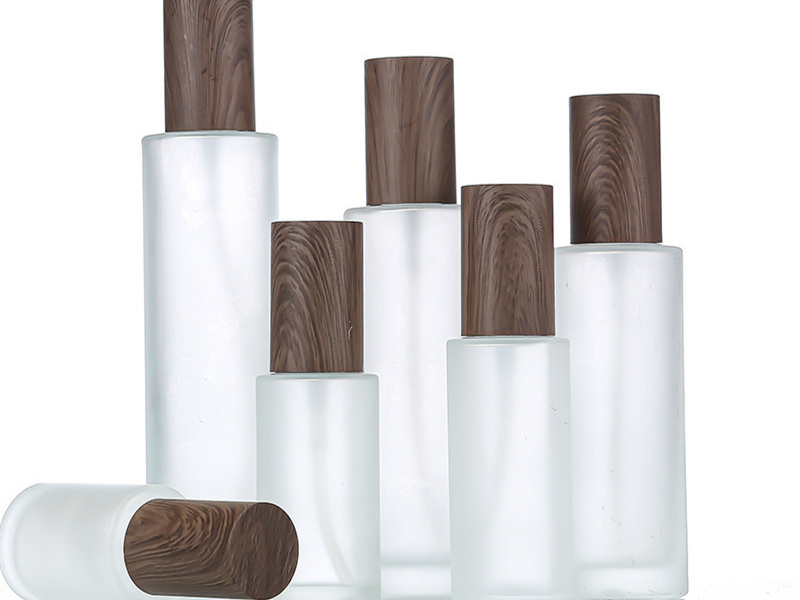 Dark wood grain cover frosted lotion bottle