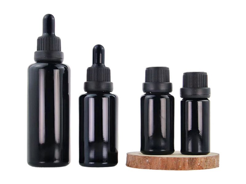 Shiny black essential oil bottle with anti-theft cover dropper bottle