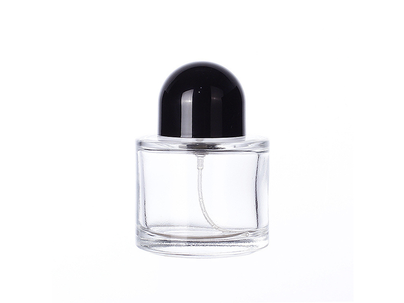 Transparent glass cylindrical perfume bottle with lid