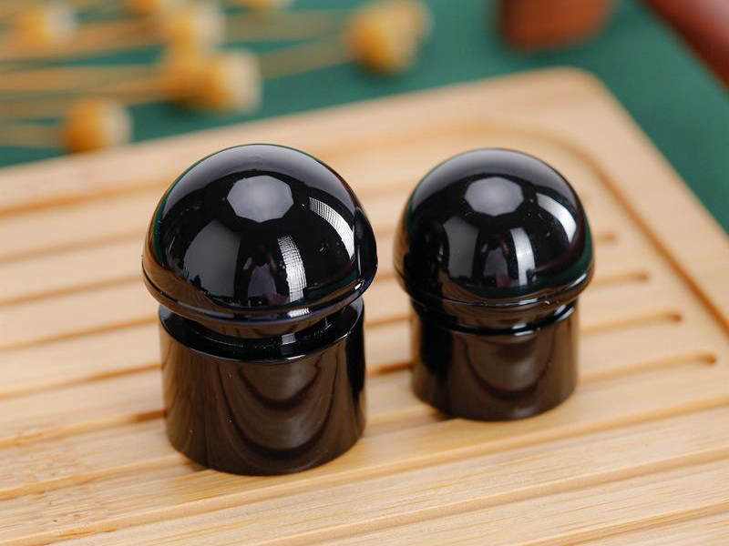 Black plastic perfume bottle cap