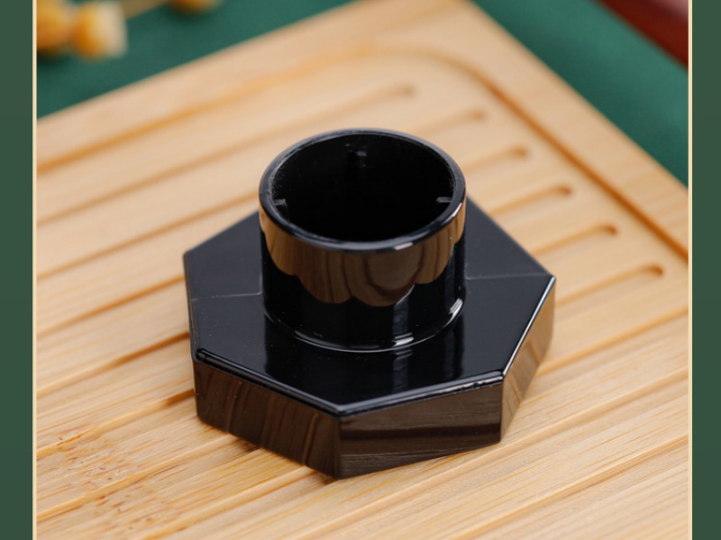 Black plastic perfume bottle cap