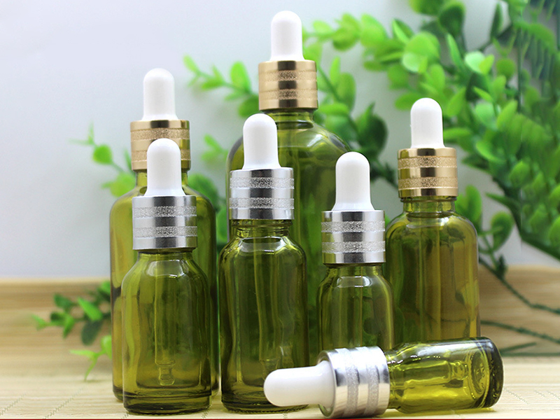 Olive green essential oil bottle