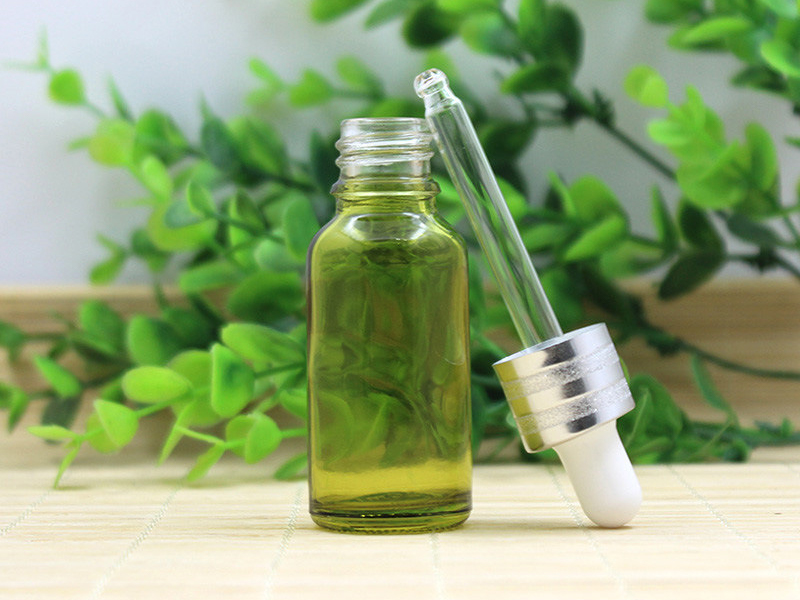 Olive green essential oil bottle