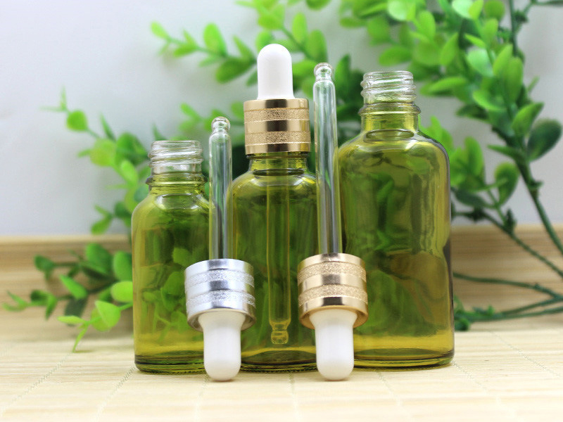 Olive green essential oil bottle