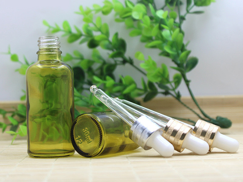 Olive green essential oil bottle